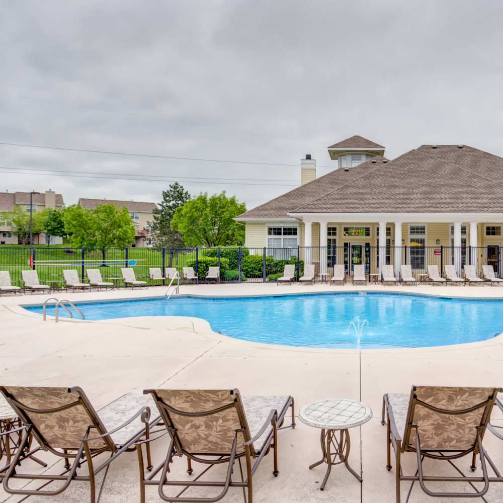 Swimming pool with lounge chairs at Northland Heights in Kansas City, Missouri