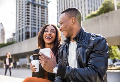 Resident couple enjoying coffee while they take a break from shopping downtown near Heritage Woods in Bel Air, Maryland