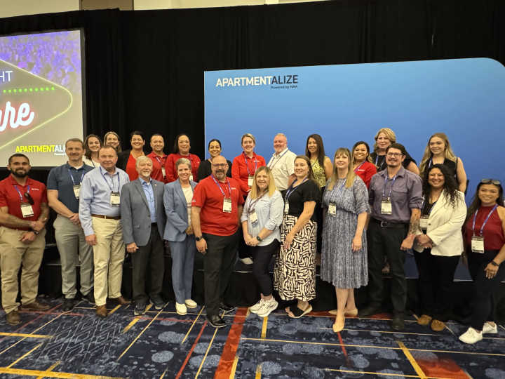 Liberty Military Housing team members pose for a group photo at NAA's Apartmentalize