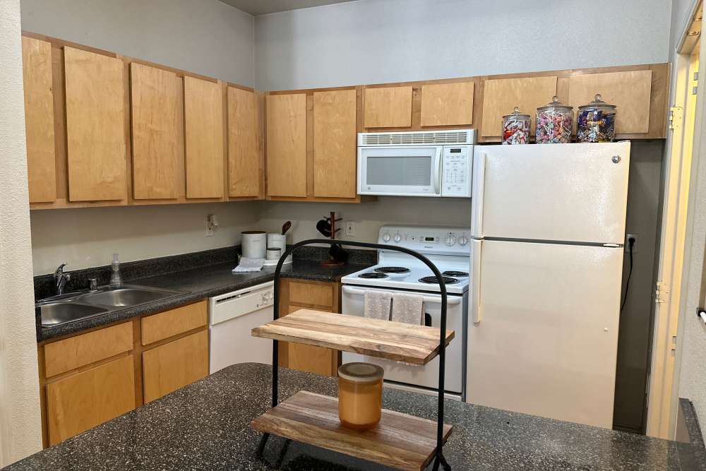 Apartment kitchen with all major appliances at The Quarters at Lawrence in Lawrence, Kansas