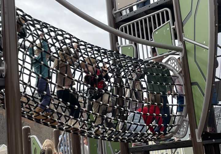 Children playing on playground in Lyman Park Community