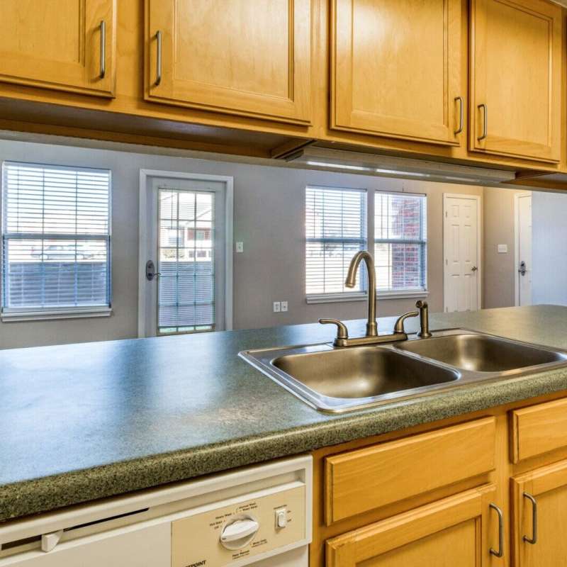 Kitchen with granite countertops at Boomer Creek Apartments in Stillwater, Oklahoma