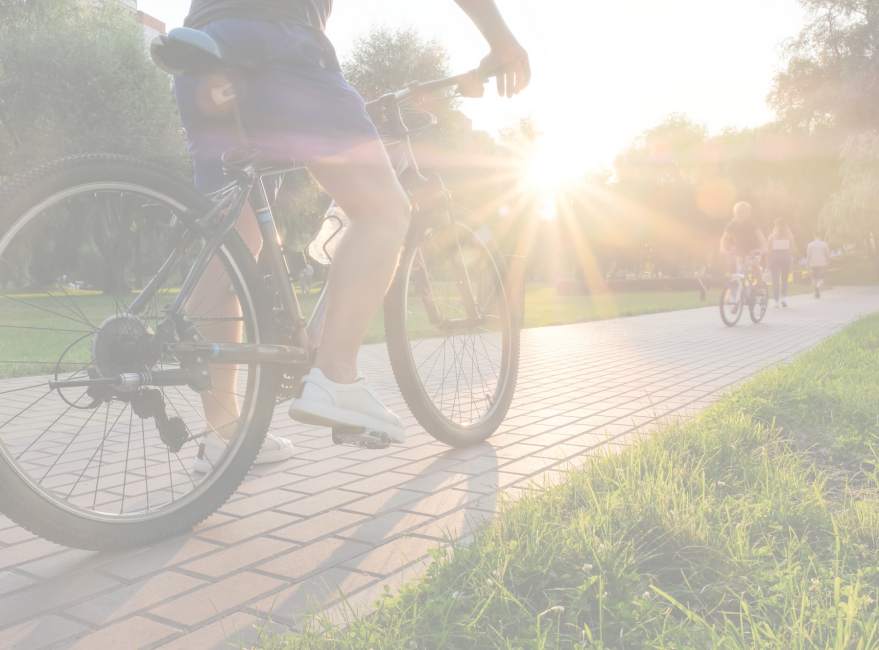 Resident riding on bike at Riverfront Park near Stonecrest Apartments in Spokane, Washington