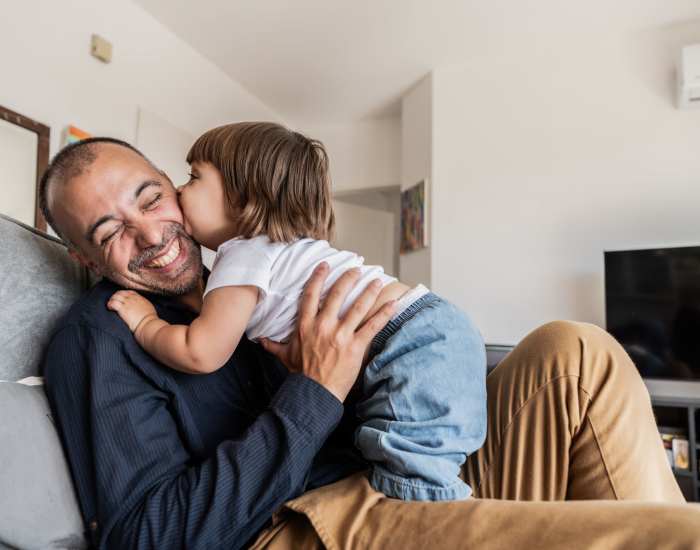 Resident father with his daughter playing in living room at Hudson Woods in Gastonia, North Carolina
