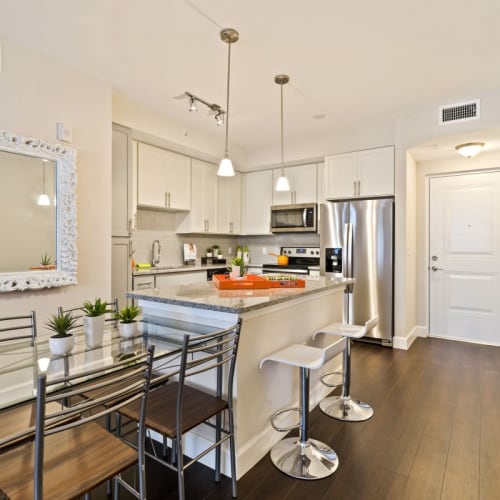 A kitchen with an island at Ventura Pointe in Pembroke Pines, Florida