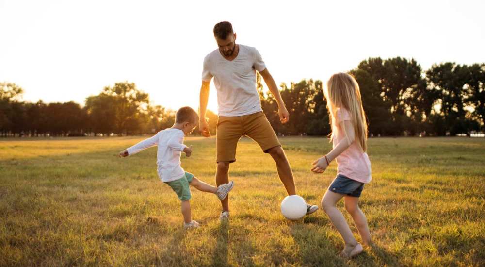 Resident playing with his kids near Sunset Lodge in Odessa, Texas            