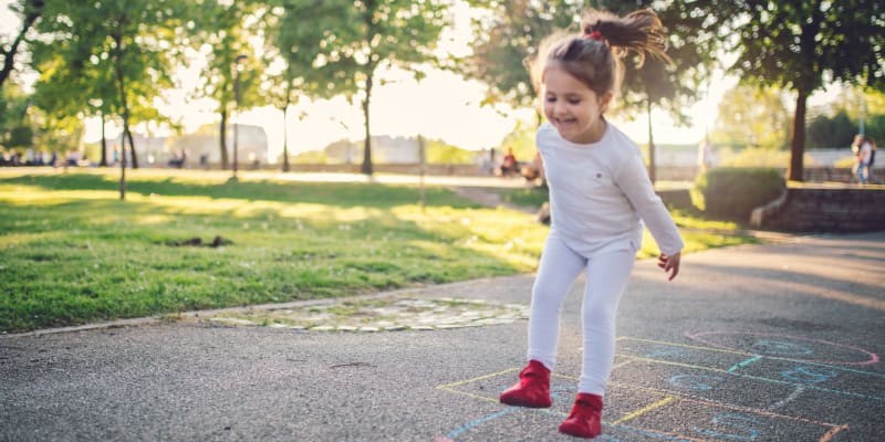 A child playing at a school near Orleck Heights in San Diego, California