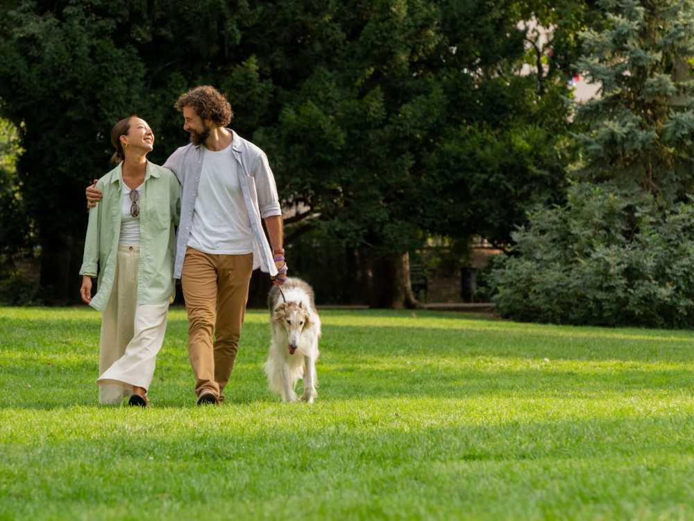 residents walking with their pet dog in a park near The Valley in Grand Rapids, Michigan 