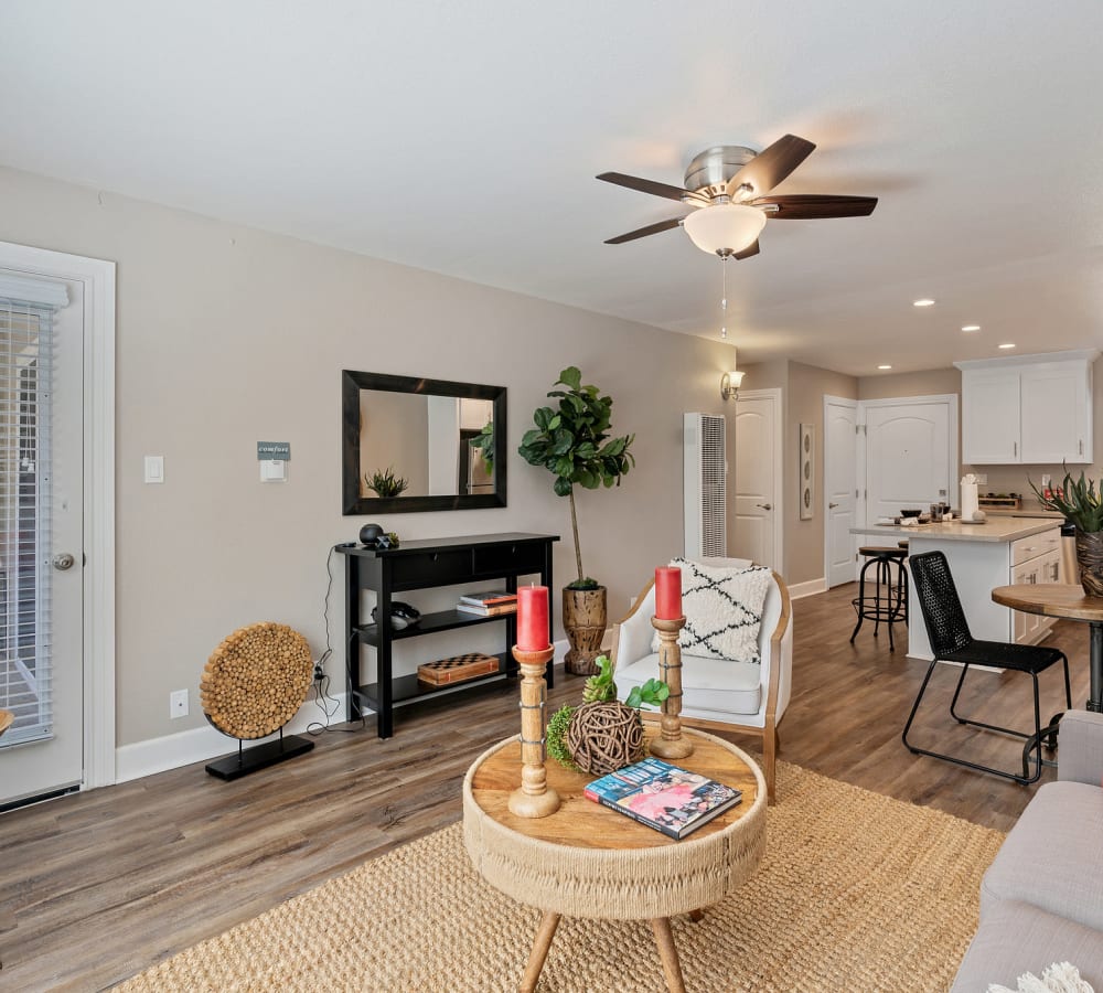 Spacious living room with door to balcony at Pinebrook Apartment Homes in Fremont, California