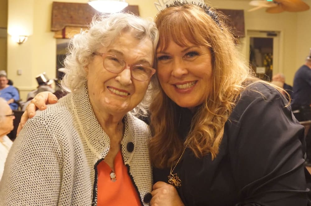 Team member and resident at a celebration at Winding Commons Senior Living in Carmichael, California