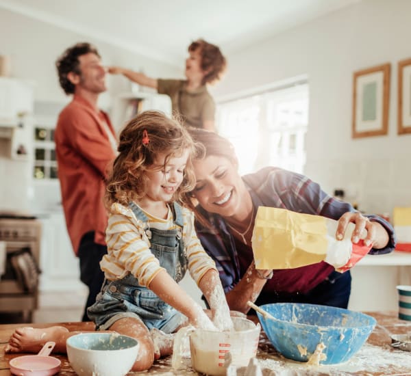Family baking together at Olde Hampton Village Apartments in Hampton, New Hampshire