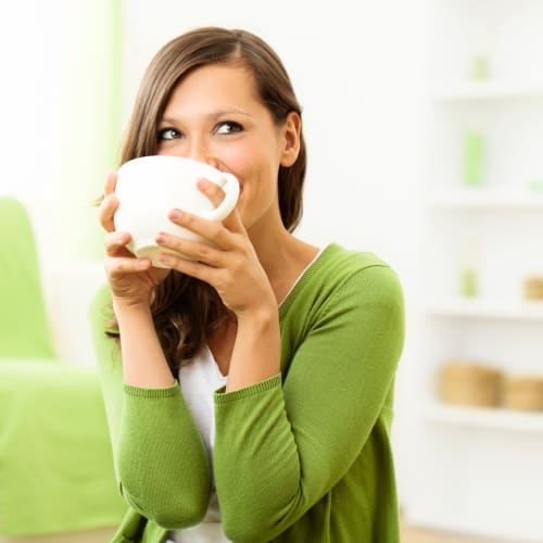 a resident having a coffee at Riverview Village in Indian Head, Maryland