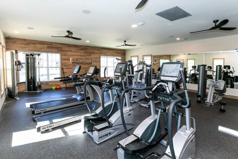Residents working out in our fitness center at Thomaston Crossing in Macon, Georgia