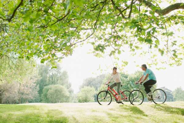 Couple biking in a park near Evergreen at River Oaks in Lake Charles, Louisiana