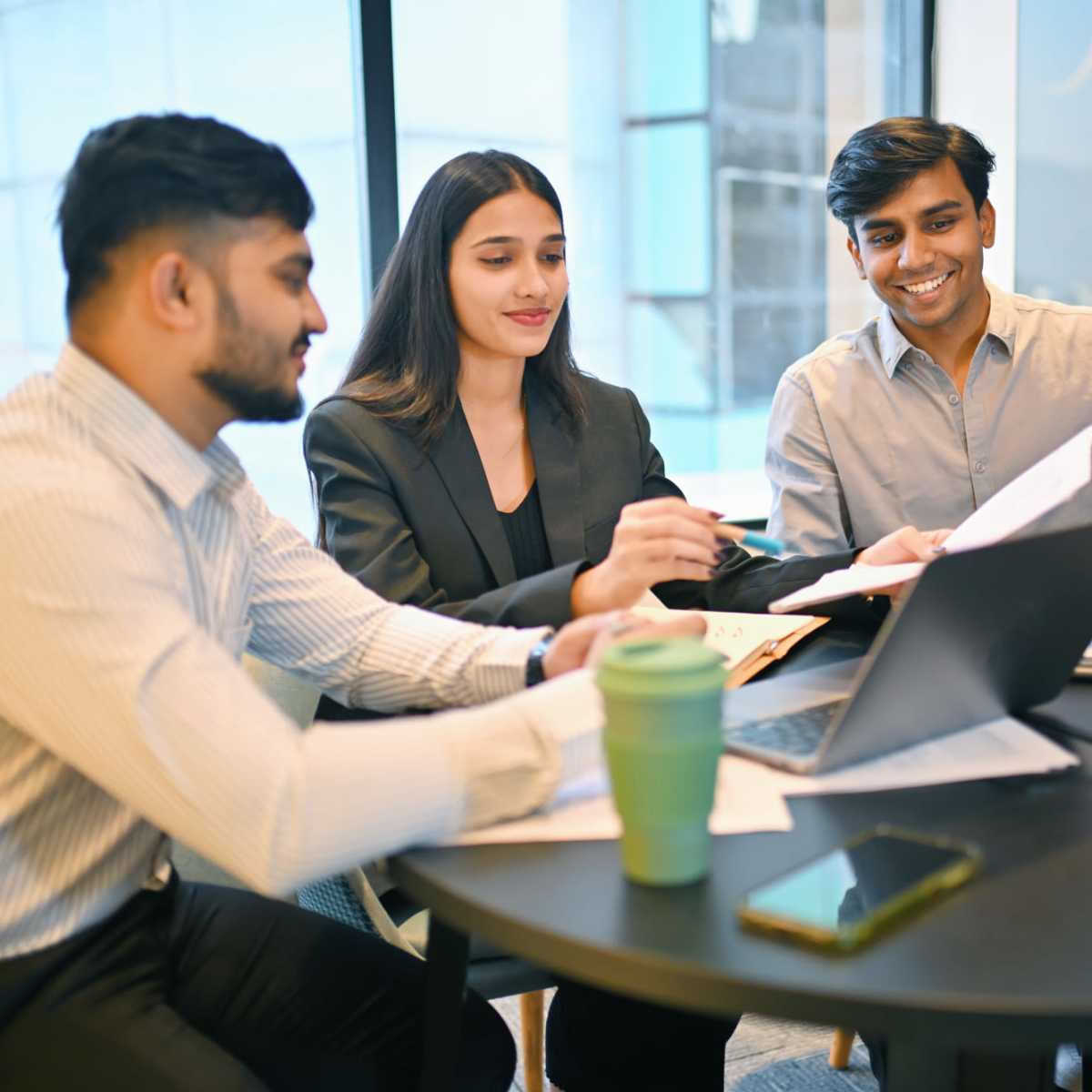 Team members working in a meeting at Emerald Properties in San Lorenzo, California
