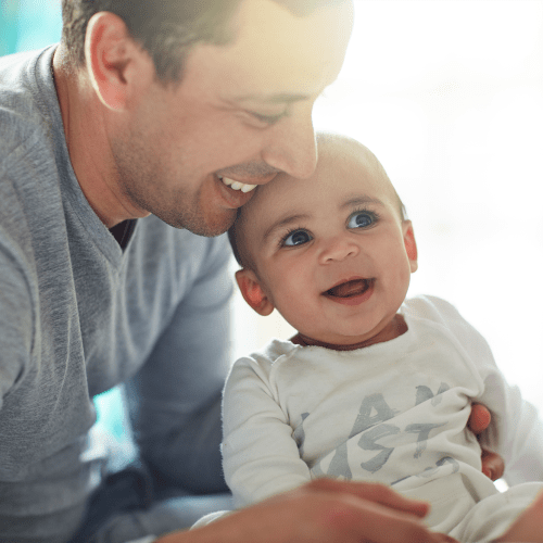 A father holding his child at Shelton Circle in Virginia Beach, Virginia