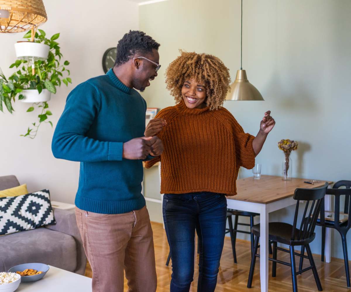 Resident dancing in their living room at Near West Village in Indianapolis, Indiana