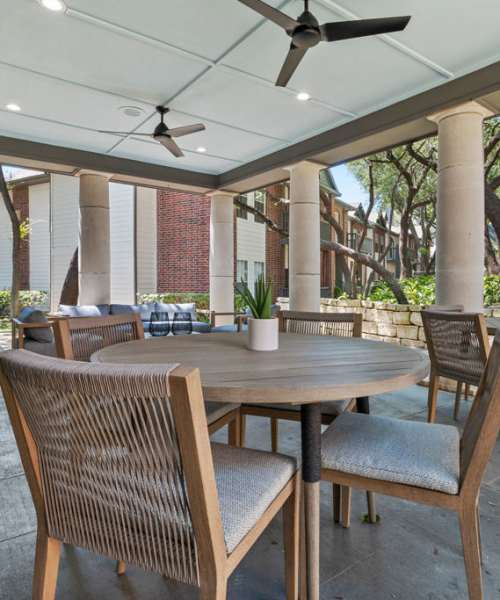 Community common area with seating spaces and ceiling fan at Charleston in San Antonio,Texas