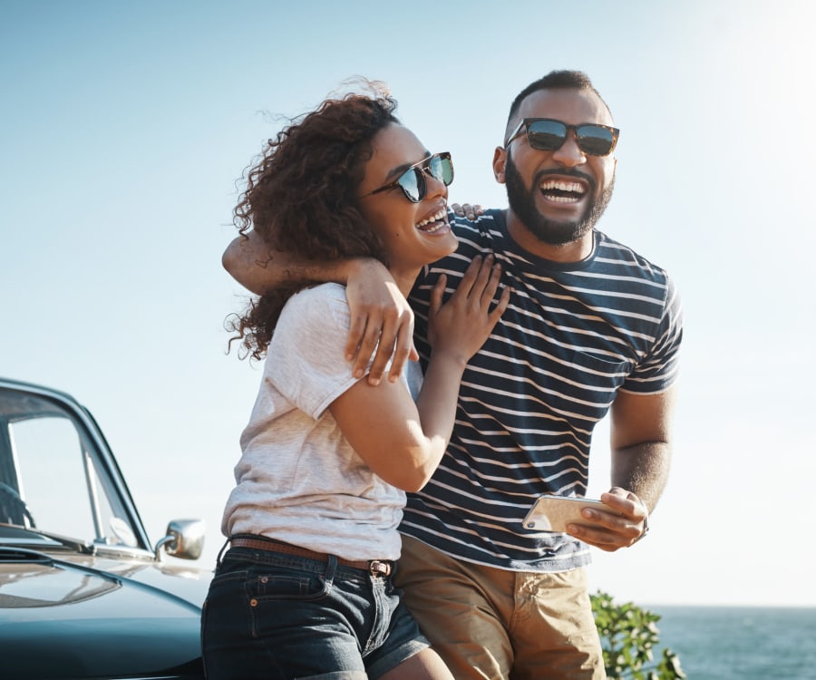 Couple smiling together at the beach at Addison at Tampa Oaks in Temple Terrace, Florida