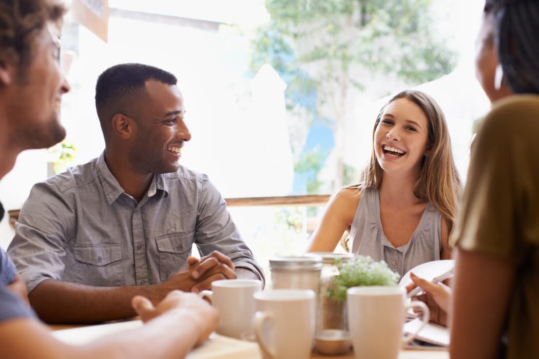 Friends enjoying a coffee at Sunchase Apartments in Tulsa, Oklahoma