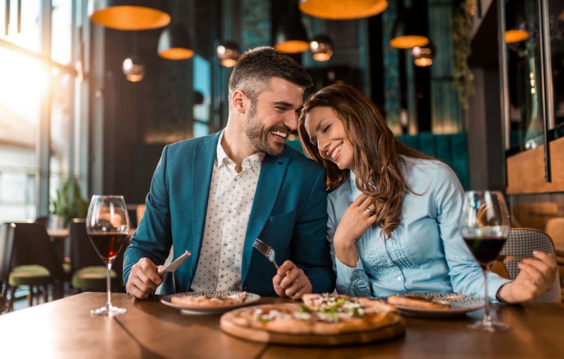 Couple out for pizza together at The Collection Townhomes in Dallas, Texas