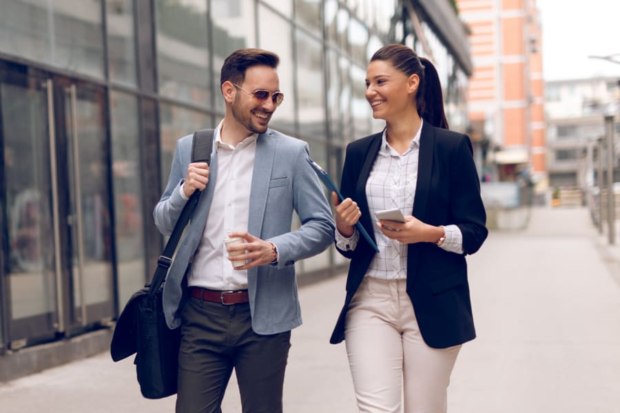 Resident discussing a project with a colleague outside their office near Sofi Belmont Hills in Belmont, California