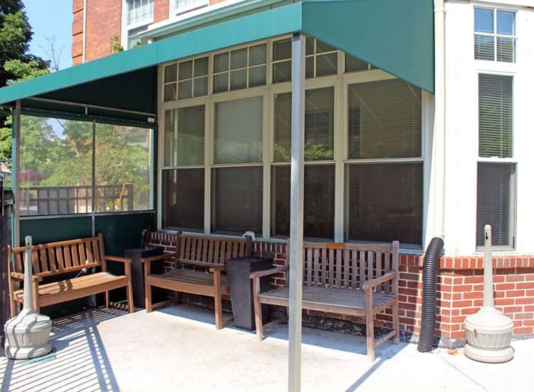 seating benches with shade at Hearth Ruggles Assisted Living in Roxbury, Massachusetts
