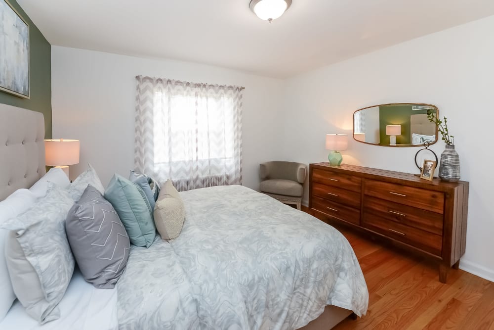 Staged bedroom at Elmwood Village Apartments & Townhomes in Elmwood Park, New Jersey