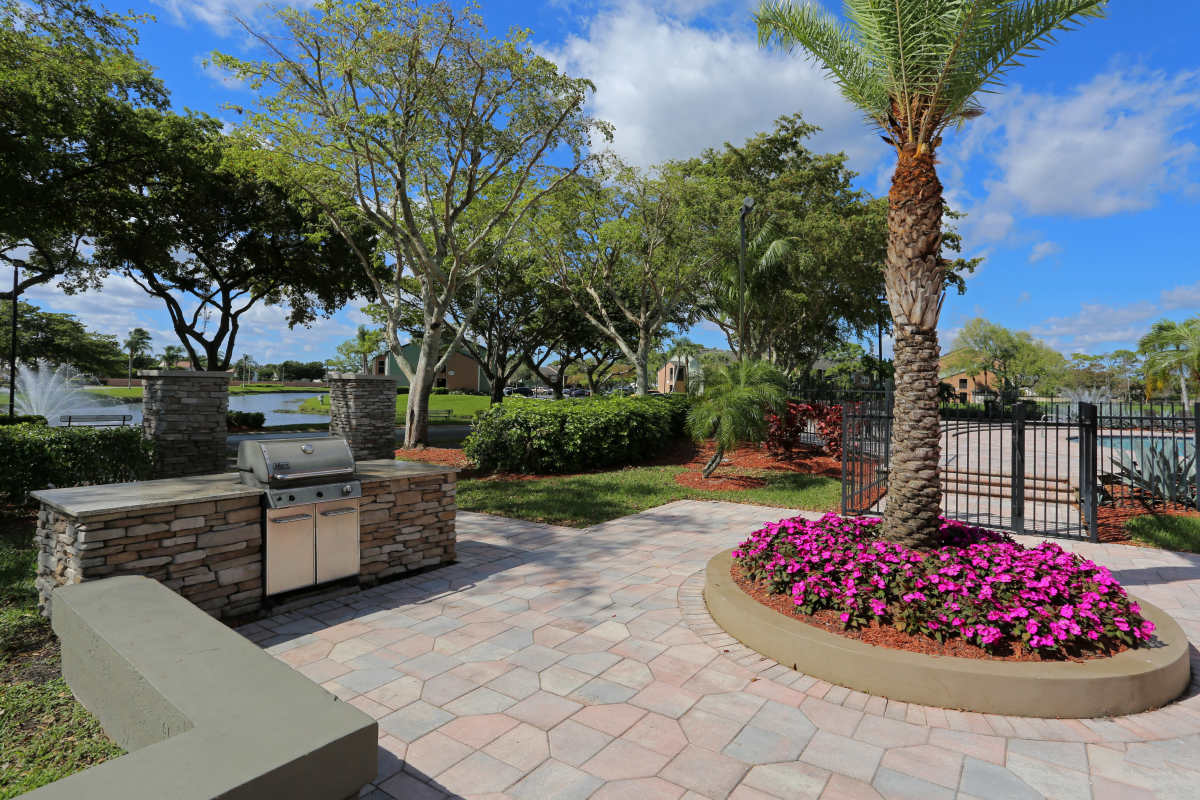 Outdoor grill station at Visions at Willow Pond apartments in West Palm Beach, Florida