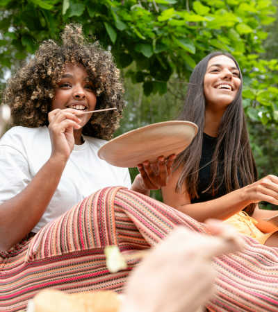Friends eating snacks in the park near The Ellison in Las Vegas, Nevada
