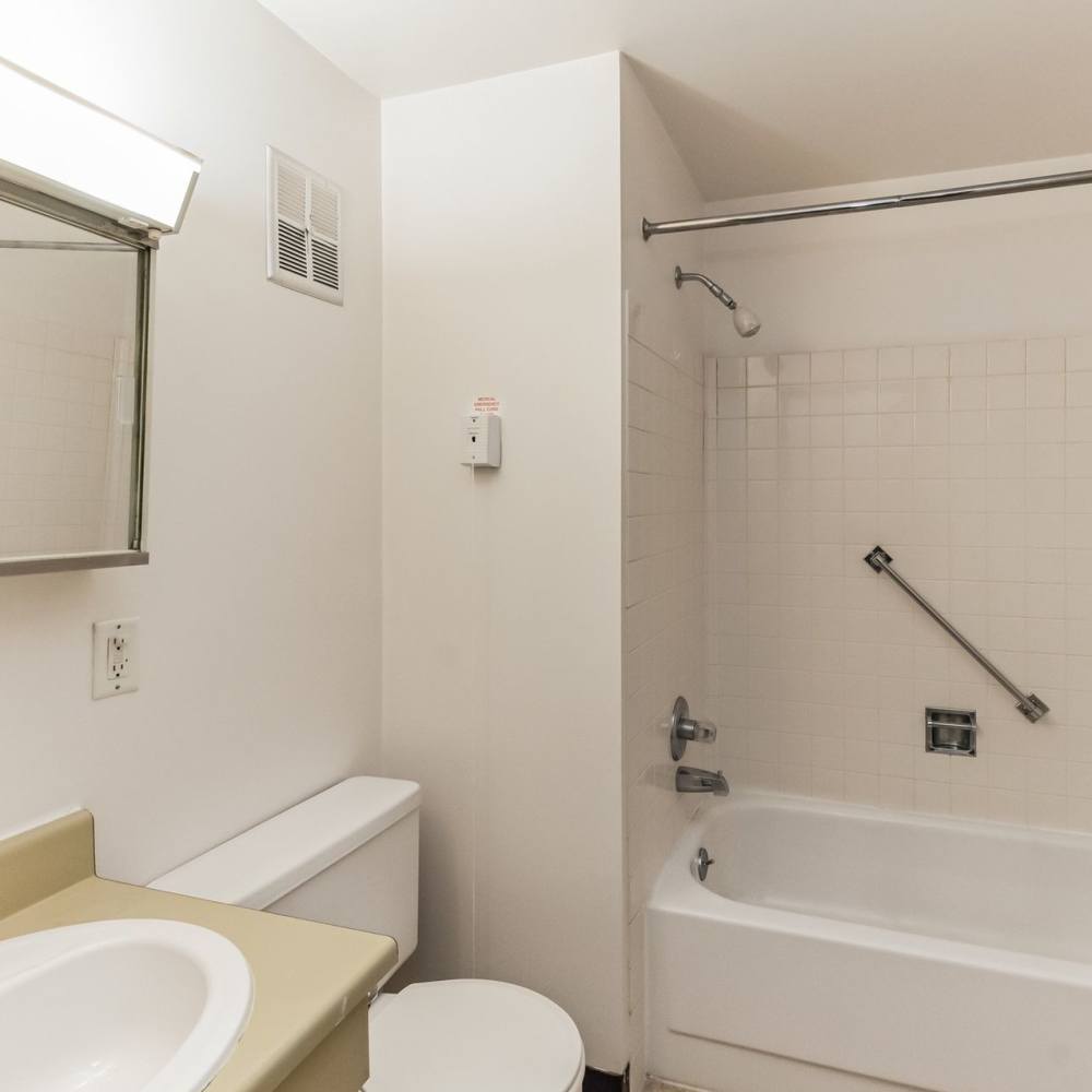Bathroom with safety grab bars at Lima Towers in Lima, Ohio
