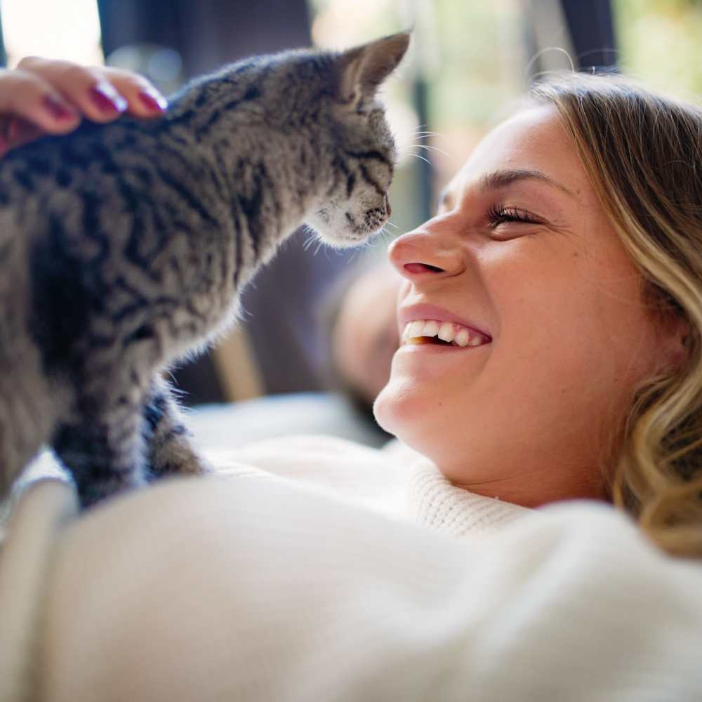 Resident playing with her cat around the pet-friendly community at Parkside Village in Roseburg, Oregon