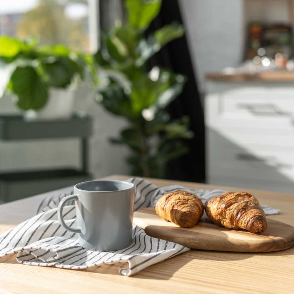 Mug with croissants next to it Cascadia at Fairwood Landing in Renton, Washington