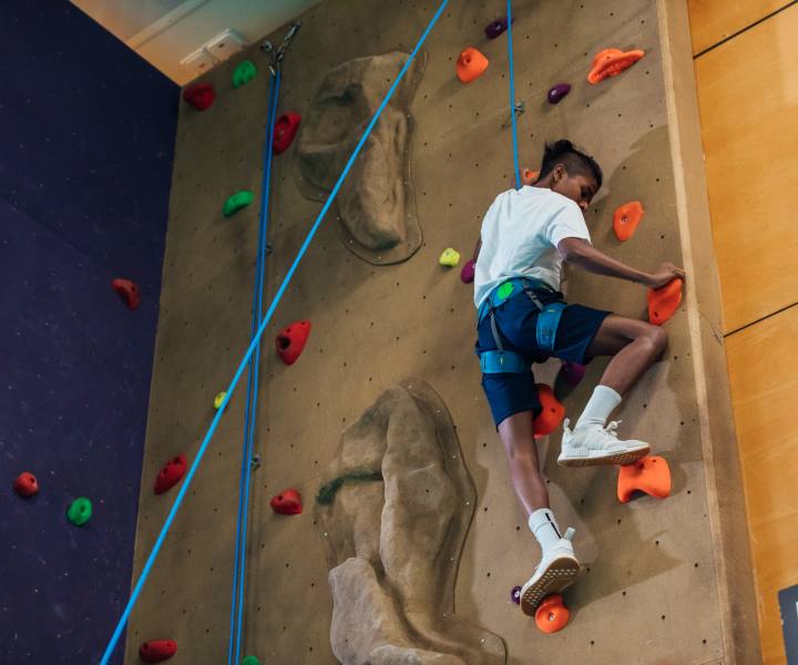 Resident using mountain climb close to Camino Real San Antonio in San Antonio, Texas