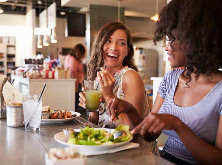 Two women enjoying salad and juice in the neighborhood near Vista Point in Reno, Nevada