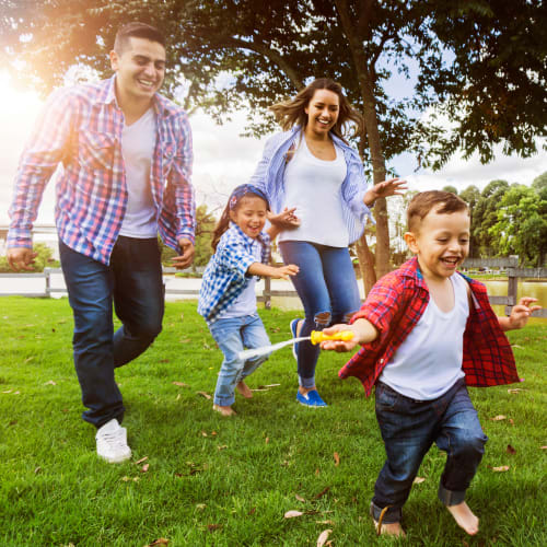 A family playing in a park near Capeharts East in San Diego, California