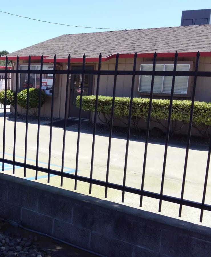 Fenced exterior of StorQuest Self Storage in Ripon, California