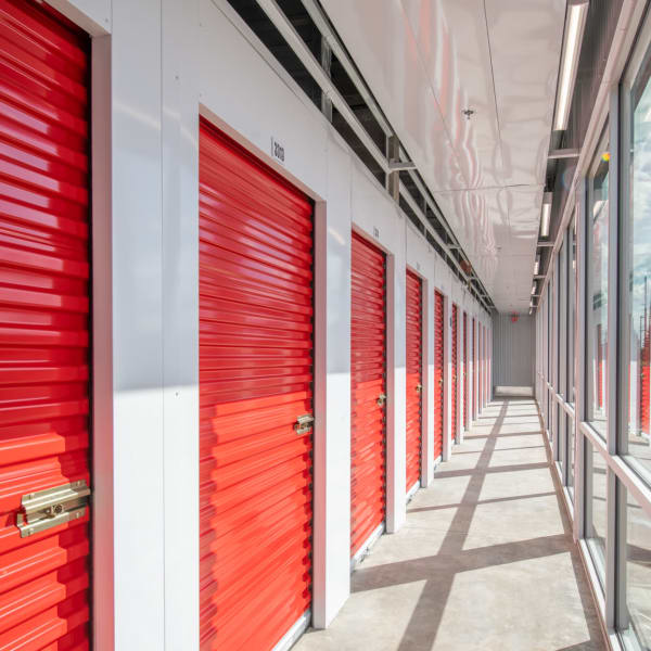 Indoor storage units with red doors at StorQuest Self Storage in Brooklyn, New York