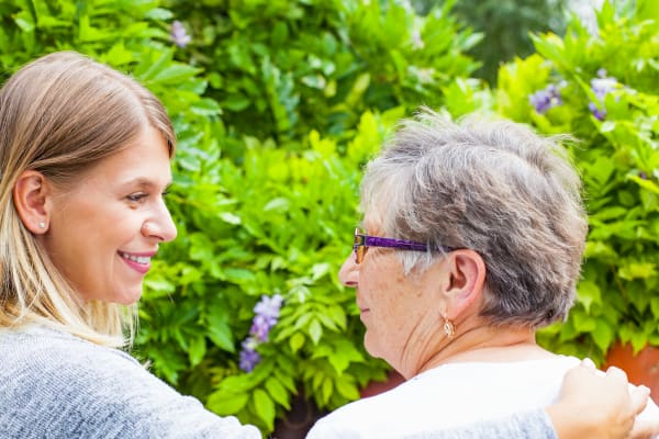 Senior woman and caregiver outside at Ramsey Village Continuing Care in Des Moines, Iowa