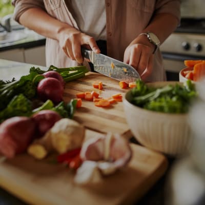 A resident preparing a meal in a kitchen at Westcott Hill in Joint Base Lewis McChord, Washington