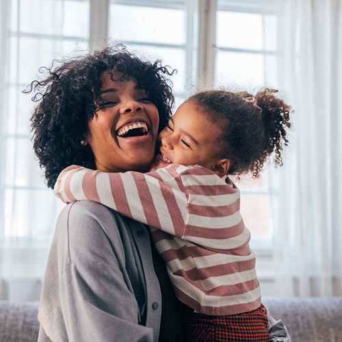 Resident with her kid in an apartment at Whitman Villas at Gateway Park in Greenfield, Indiana