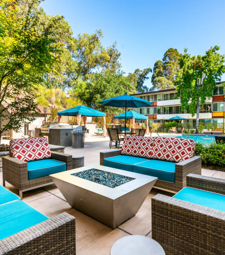 Barbecue area with a gas grill for resident use near the swimming pool at Sofi Belmont Glen in Belmont, California