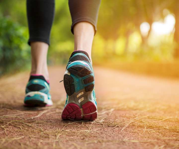 Resident walking on a trail near The Grove at Oakbrook in Summerville, South Carolina