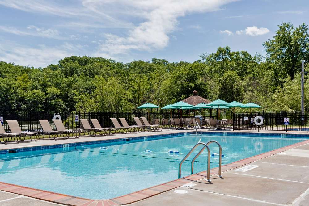 Pool Area with Set of Deck Chairs at Eagle Rock Apartments at Mohegan Lake in Mohegan Lake, New York