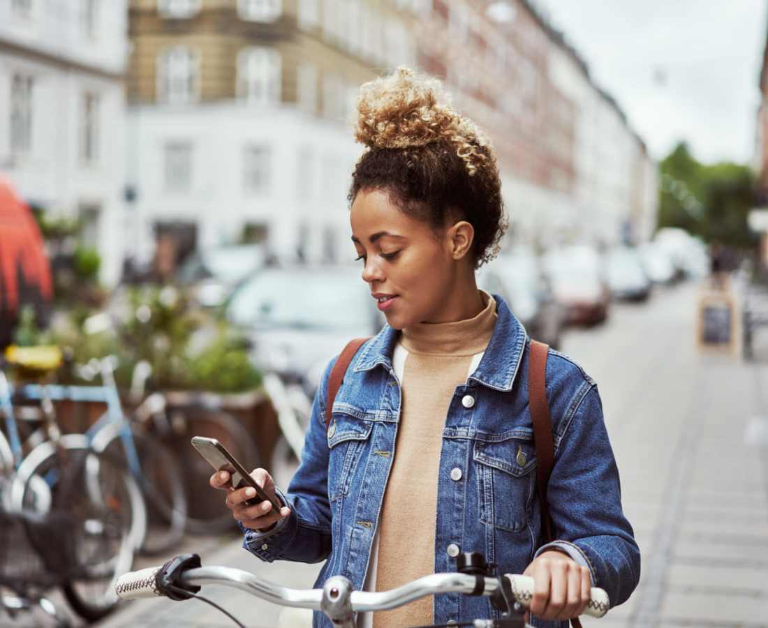 Resident looking at her phone in the city near Waters Edge in Sacramento, California