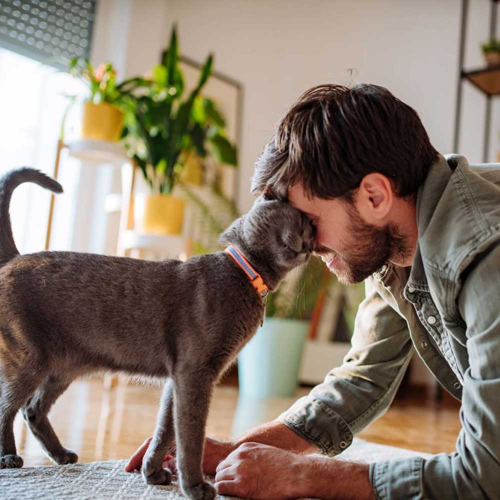 Resident loving his pet at Ocean View Living in Norfolk, Virginia