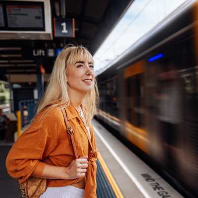 Woman waiting at metro near Stony Brook Village in Hyde Park, Massachusetts