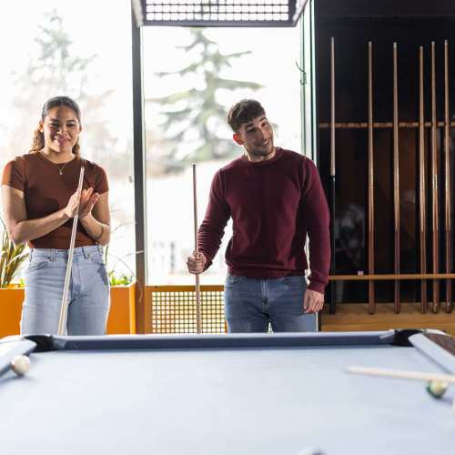 Residents in a clubhouse at Arden at South Point Apartment Homes in McDonough, Georgia