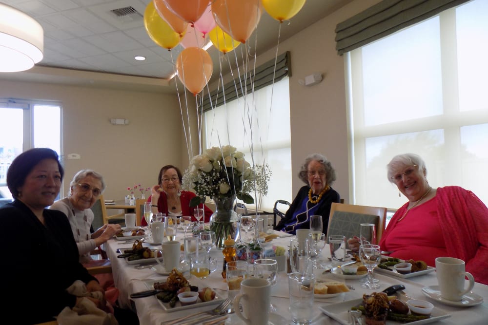 Residents enjoying their May birthday lunch at Merrill Gardens at Rockridge in Oakland, California. 