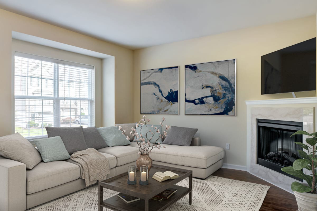 Living room with a fireplace at Emerald Pointe Townhomes in Harrisburg, Pennsylvania